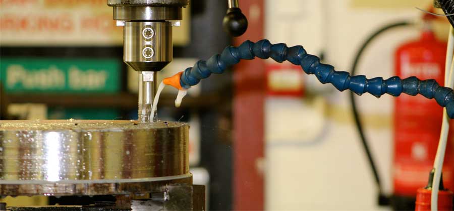 Close up of water being sprayed on to a CNC Milling machine